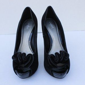Black suede ruffle pumps